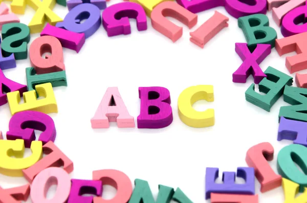Word Abc Laid Out Wooden Multicolored Letters Surrounded Scattered Colored — Stock Photo, Image