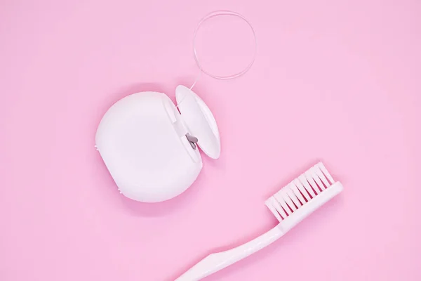 Oral Care White Toothbrush Dental Floss Pink Background Top View — Stock Photo, Image