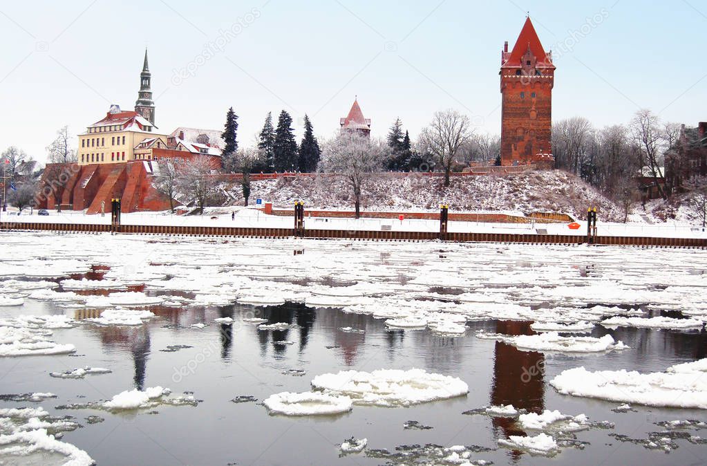Cityscape of Tangermuende in winter time with ice on Elbe river.