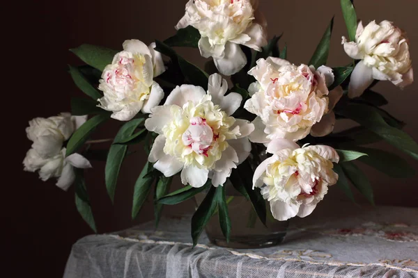Bouquet of peonies. Flowers in a vase. Still life with garden white peonies.