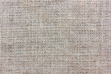 Çuval bezi, bez, kumaş dokusu. Arka plan, zemin, malzeme. Zor konu, üstten görünüm örgü.