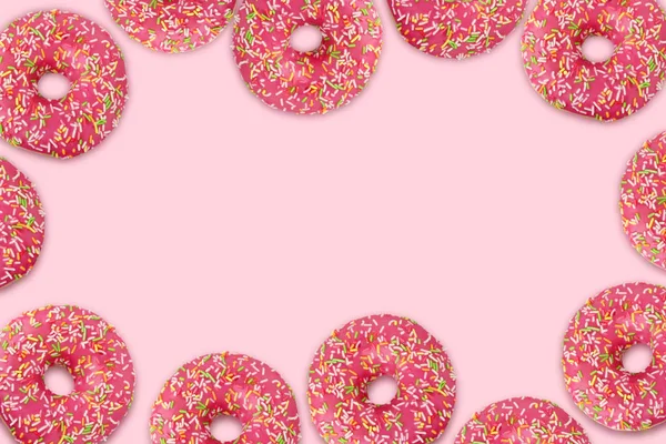 Donuts sobre fondo rosa, espacio vacío para Tu texto en el céntimo —  Fotos de Stock