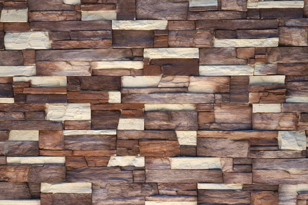 Parede é feita de pedra artificial. fundo, textura — Fotografia de Stock
