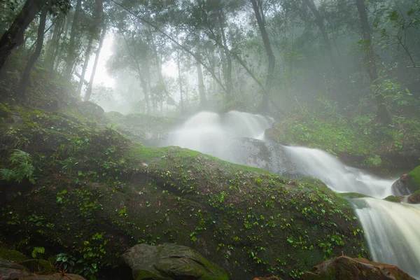 Big waterfall in forest in rain season with foggy location at north of Thailand