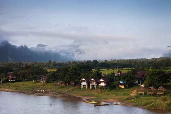Landscape view of mountain with foggy under clear sky located at tropicana location at Vang Vieang Laos