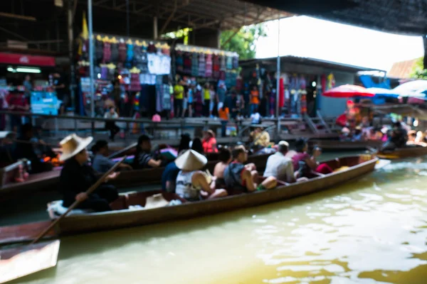 Blur of Thailand floating market in weekend. Local business culture style of Thailand.