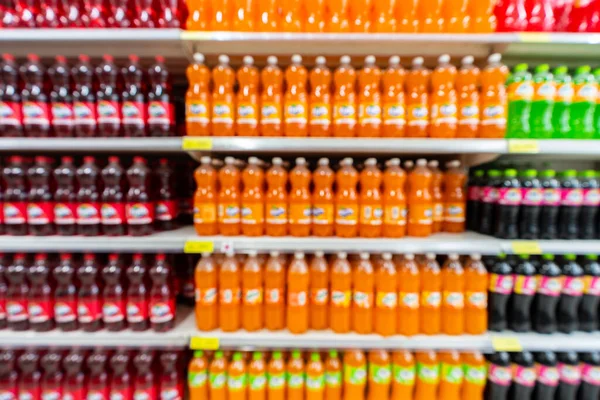 Blur image of shelf with consumer product shop in supermarket