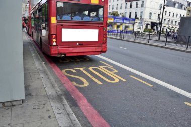 Double Decker red bus is running on road in London clipart
