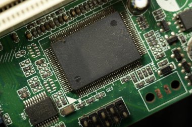 Close-up of electronic chip in desktop computer motherboard circuit. clipart