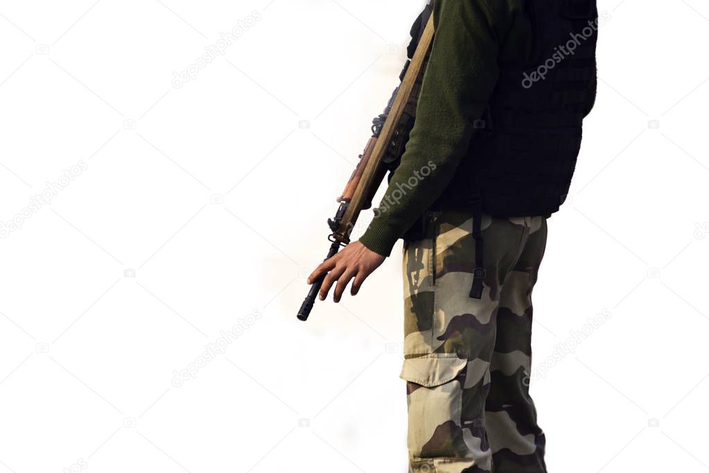 Security guard standing with rifle on white background