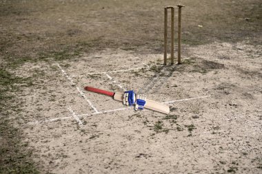 Kriket sopası ve eldiven boş Kriket Sahası üzerinde oynamak için vardır.