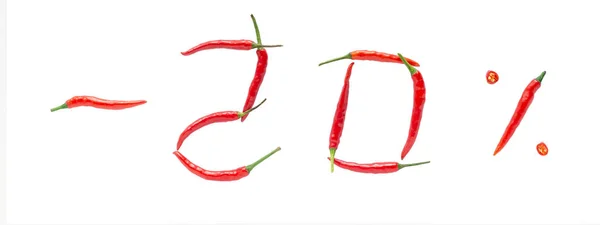 Hot sale or discount concept. Writing made of fresh chilli peppers on white background. Twenty percent discount rate.