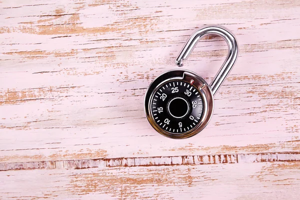 Code lock on wood desk. Safe concept. Deposit