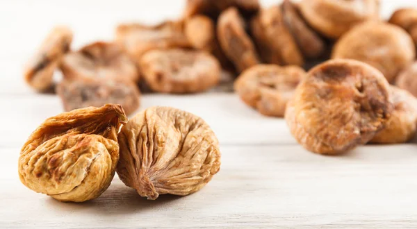 Dry fig close up on wood desk. Food ingredients. Health