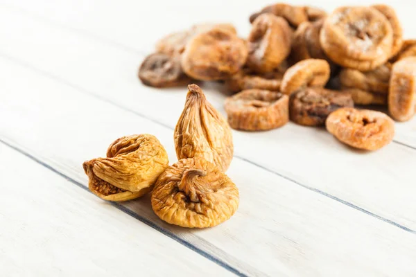 Dry fig close up on wood desk. Food ingredients. Health