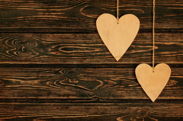 Wood heart on wood background. Valentines background