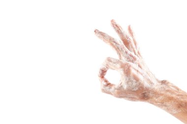 Beyaz arka plan üzerinde izole sabun ile okey el göster