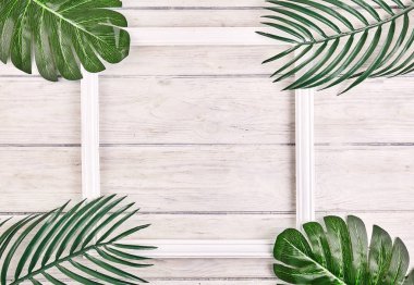 Tropikal yaprak vintage çerçeve ile yapılmış yaratıcı düzeni.