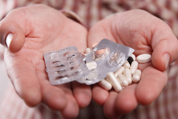 Pills in hand close up