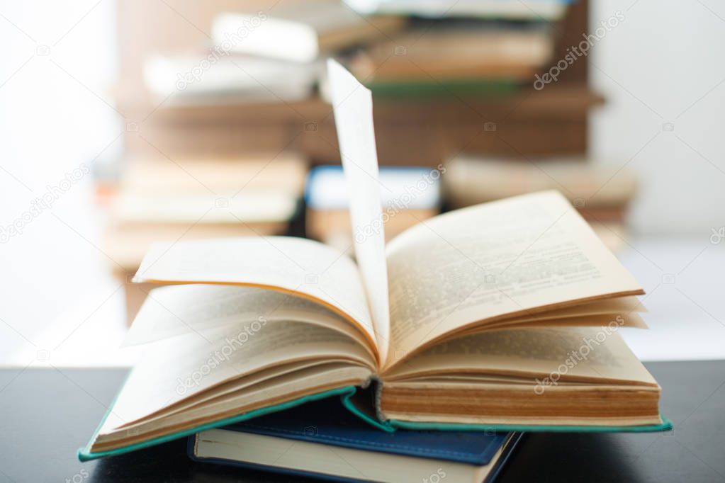 Education concept. Stack of books on table.