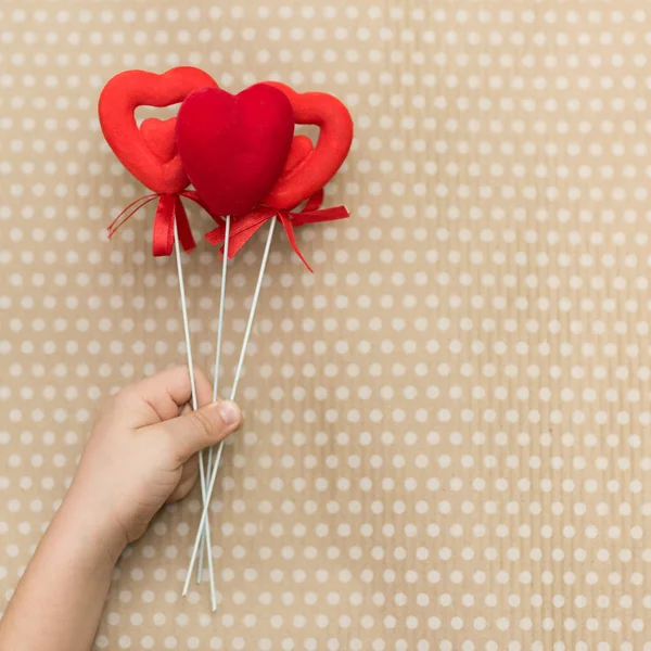 Valentines Day Child Holding Red Hearts Sticks Background Cardboard Paper — Stock Photo, Image