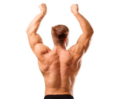 Genç yakışıklı vücut geliştirmeci adam kas görünümü ile poz