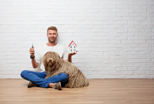 Handsome Blonde Man Dog House Model Keys — Stock Photo, Image