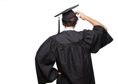 sakallı adam arkadan görünüm mezun, kalça, diğer eliyle bir yere uzak mesafe bir nesneye işaret ver..