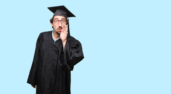 Young Graduated Man Leaning Forward Whispering Secret Serious Surprised Look — Stock Photo, Image