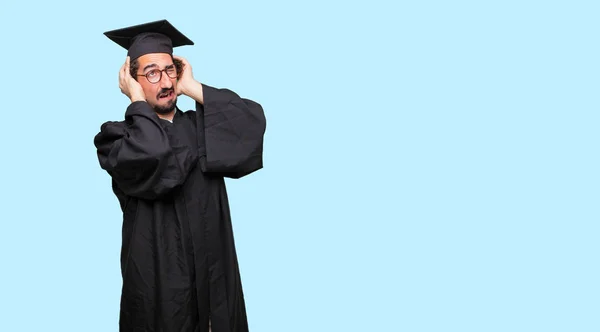 Young Graduated Man Both Hands Covering Ears Protect Them Uncomfortable — Stock Photo, Image