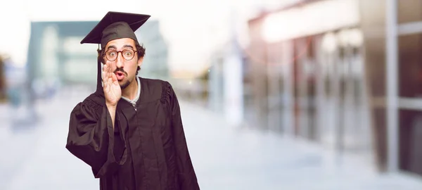 Young Graduated Man Leaning Forward Whispering Secret Serious Surprised Look — Stock Photo, Image