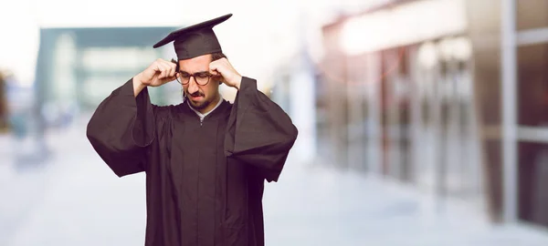 Young Graduated Man Looking Stressed Frustrated Looking Upwards Holding Both — Stock Photo, Image