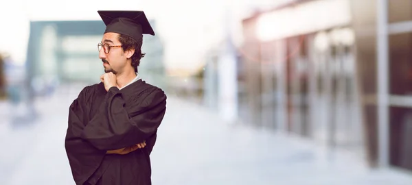 Young Graduated Man Confused Thoughtful Look Looking Sideways Thinking Wondering — Stock Photo, Image