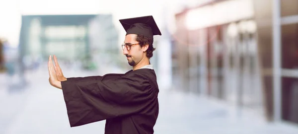 Young Graduated Man Signaling Stop Both Palms Hands Facing Forward — Stock Photo, Image