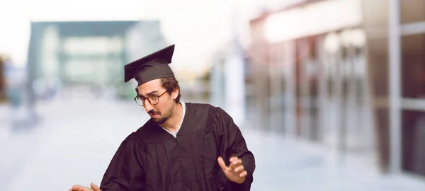 Young Graduated Man Crazy Amazed Look Surprise Holding Head Both — Stock Photo, Image