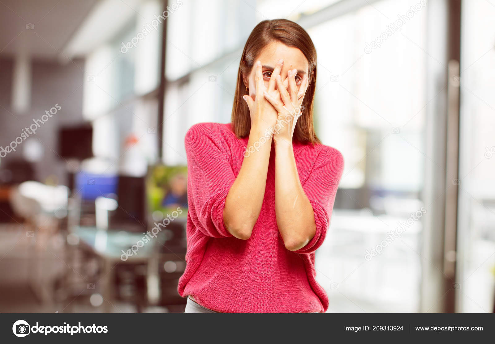 Scared beautiful girl looks with frightened expression, eyes full