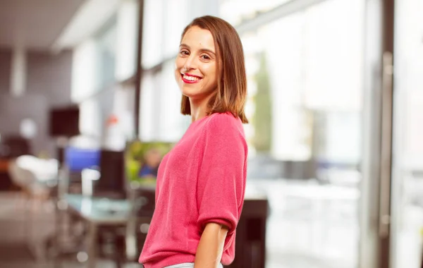 young woman full body. with a satisfied and happy look on her face, smiling sincerely an affectionate smile. Side or lateral view.