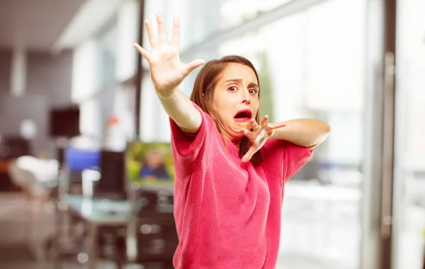 young woman full body. looking scared, frightened and horrified, screaming in terror, facing doom, feeling very afraid.