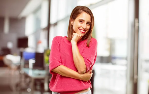 young woman full body. with a proud, confident and happy look, smiling and feeling satisfied, lateral or side view.