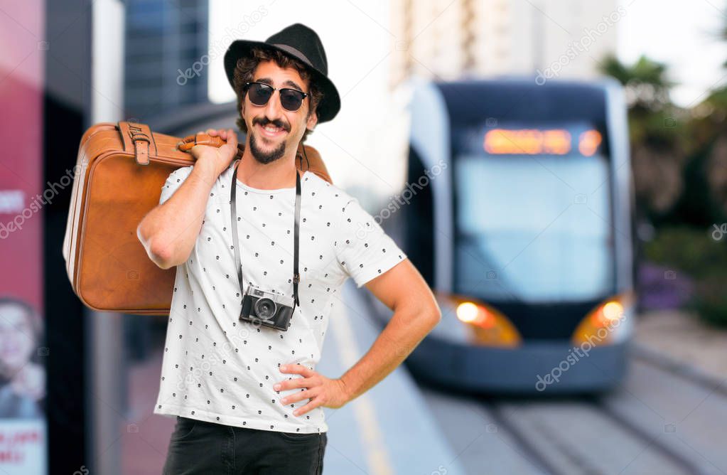 Young bearded cool traveller man with a bag. Holidays concept.