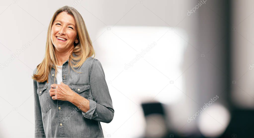 senior beautiful woman Laughing out loud with head tilted backwards and happy, cheerful expression