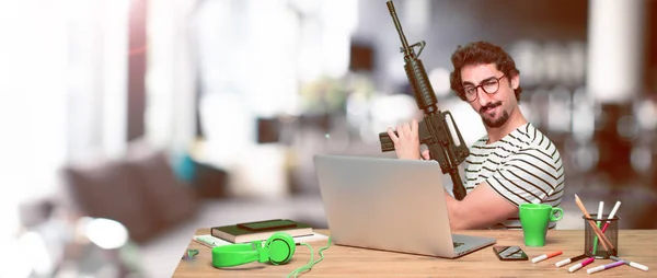Young Crazy Graphic Designer Desk Laptop Rifle Conflict Concept — Stock Photo, Image
