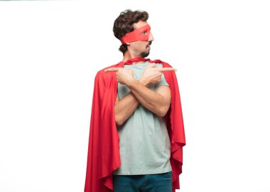 Genç deli süper kahraman adam. Şaşkın ifade.