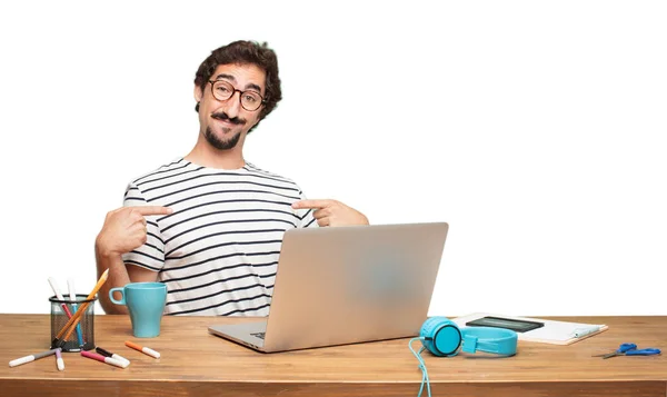 young bearded man graphic designer. Pointing and showing gesture.