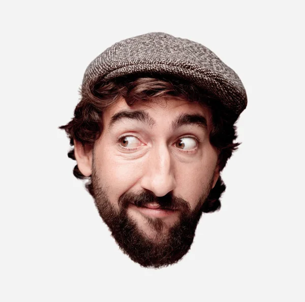 Genç deli adam kesme baş ifade izole sakallı. Bir bere takıyor. Düşünme kavramı.