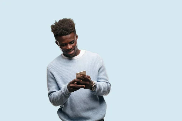 young black man using a smart mobile telephone