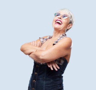 senior cool woman Laughing out loud with head tilted backwards and happy, cheerful expression clipart