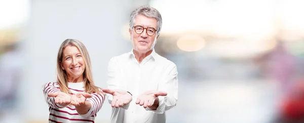 Senior Cool Husband Wife Smiling Satisfied Expression Showing Object Concept — Stock Photo, Image