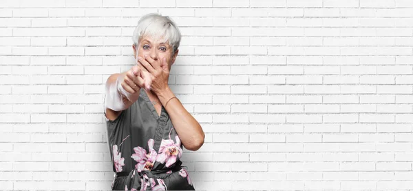 Senior Cool Woman Laughing Hard Something Hilarious Pointing Sideways While — Stock Photo, Image