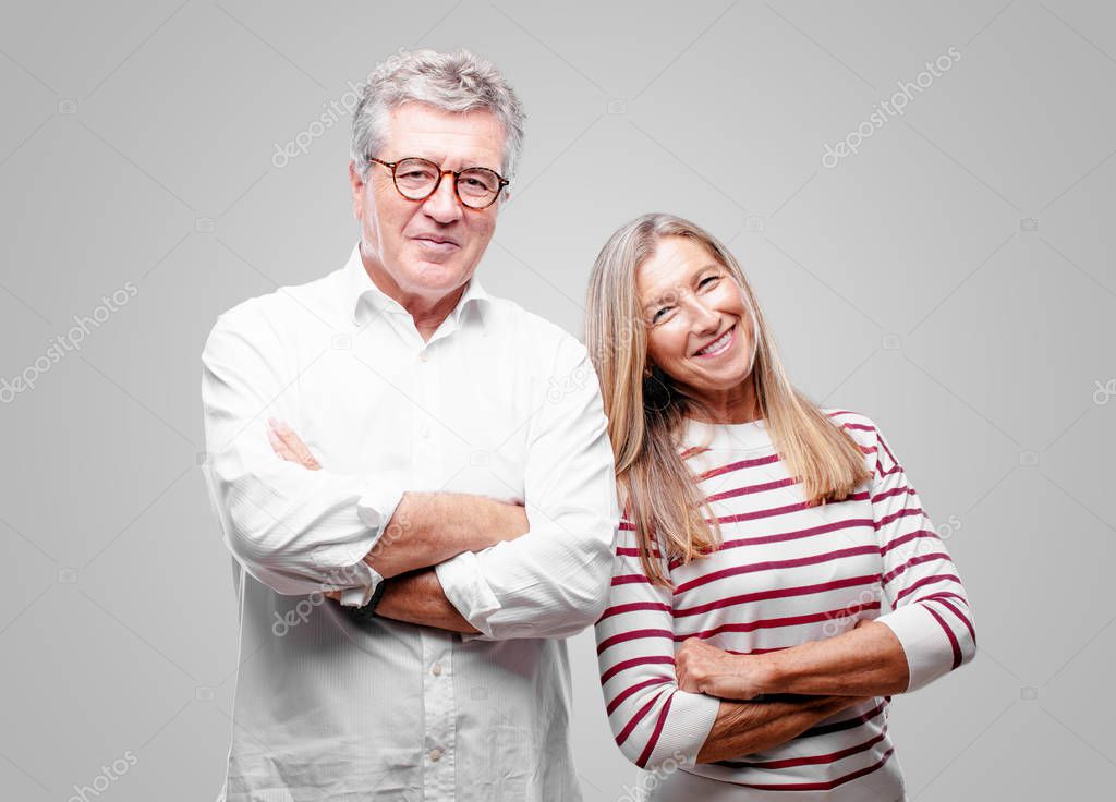 senior cool husband and wife Laughing out loud with head tilted backwards and happy, cheerful expression
